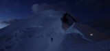 Cordée dans la nuit sur l'arête des Bosses