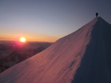 Rope team arrives at sunrise on the summit of Mont Blanc